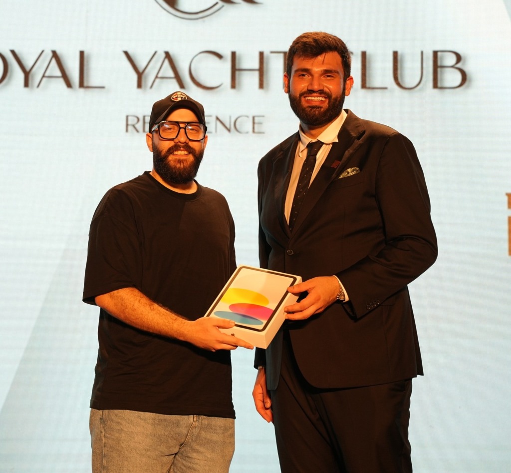 Instagram story competition winner receiving an iPad on stage