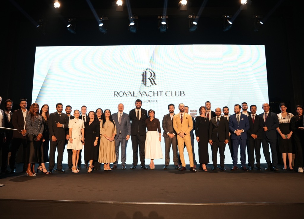 Group photo on stage at the Royal Yacht Club Residence launch event